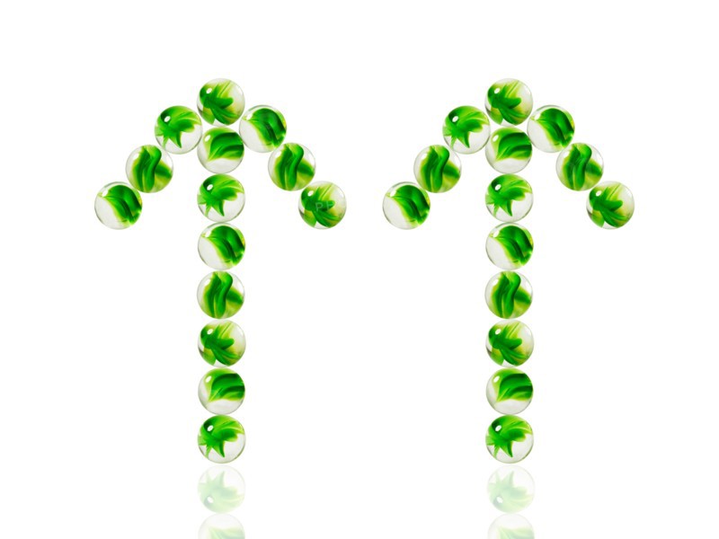 Studio shot of green marbles arranged in Exclamation Point. Photo : David Arky