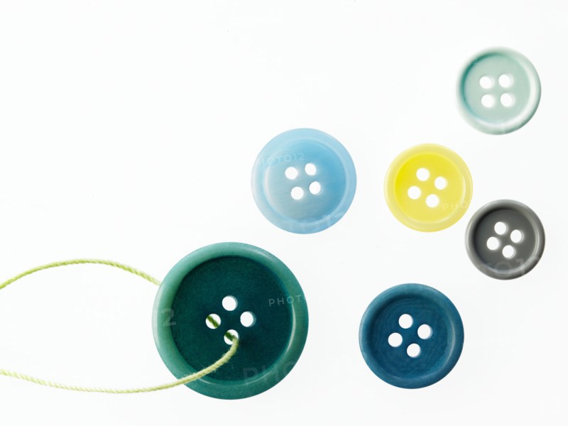 Studio shot of green marbles arranged in Exclamation Point. Photo : David Arky
