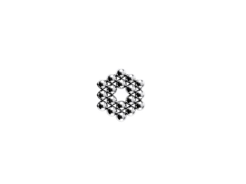 Studio shot of Pachinko balls arranged in hexagon. Photo : David Arky