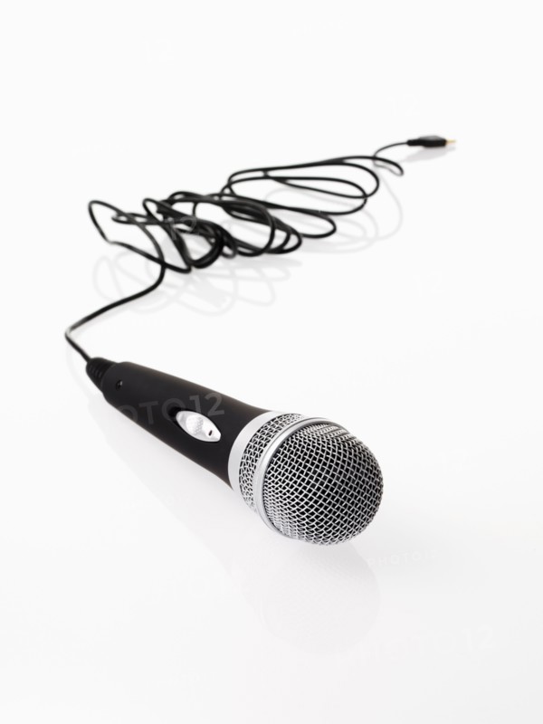 Studio shot of microphone and microphone cable on white background. Photo : David Arky