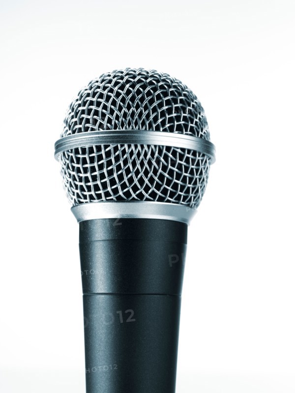 Studio shot of microphone on white background. Photo : David Arky