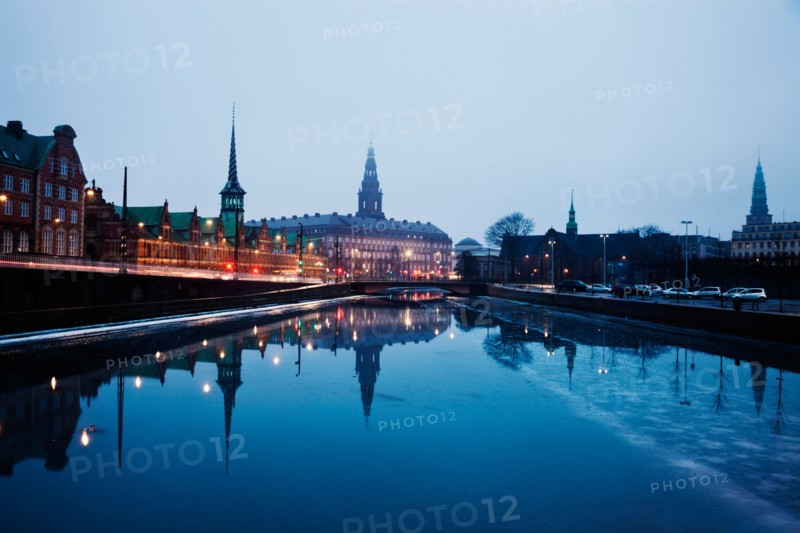 Denmark, Copenhagen. View over canal towards Copenhagen Stock Exchange and Christiansborg Castle. Photo : Henryk Sadura