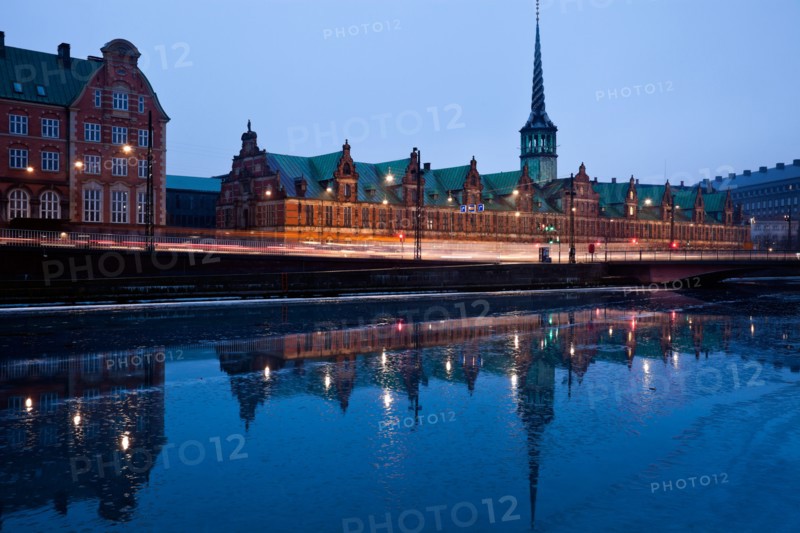 Denmark, Copenhagen. View over canal towards Copenhagen Stock Exchange and Christiansborg Castle. Photo : Henryk Sadura
