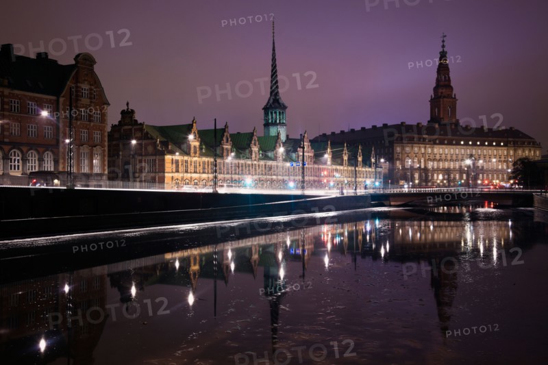 Denmark, Copenhagen. View over canal towards Copenhagen Stock Exchange and Christiansborg Castle. Photo : Henryk Sadura