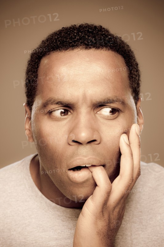 Studio shot of surprised mid adult man. Photo : Rob Lewine