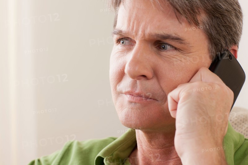 Man talking on phone. Photo : Rob Lewine