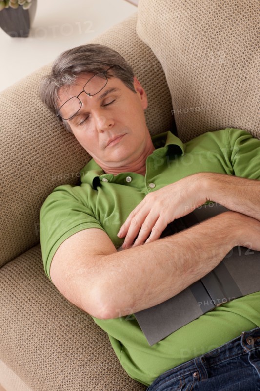 Man napping on couch. Photo : Rob Lewine
