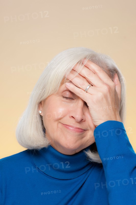 Studio shot of surprised senior woman. Photo : Rob Lewine