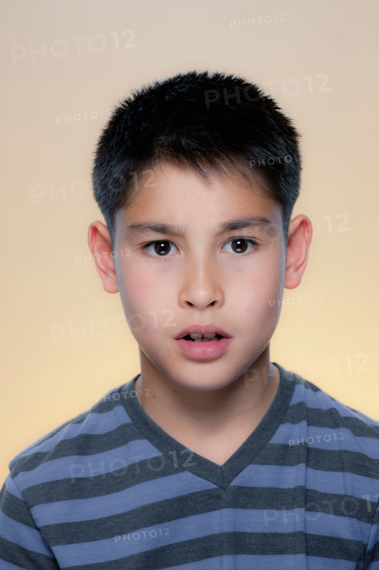 Portrait of boy with concerned expression. Photo : Rob Lewine