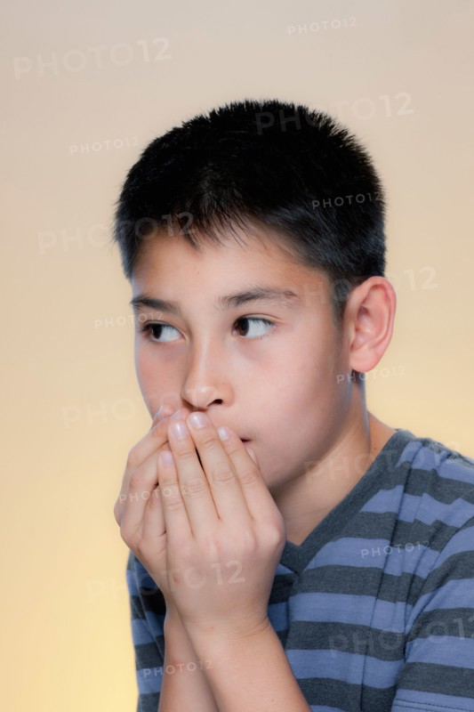 Portrait of scared boy. Photo : Rob Lewine