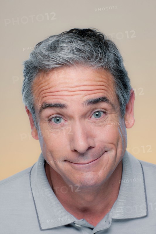 Studio Portrait of mature man smiling. Photo : Rob Lewine
