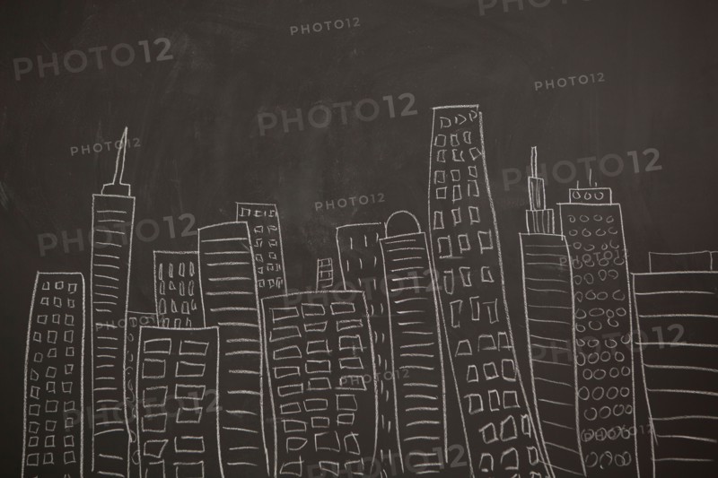 Modern city skyline drawn on blackboard. Photo : Jessica Peterson