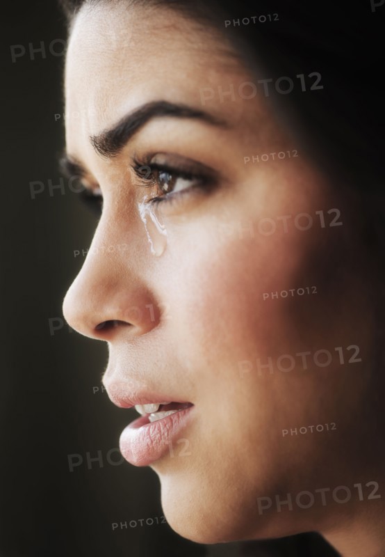 Close-up of young woman crying.