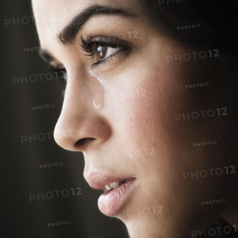 Close-up of young woman crying.