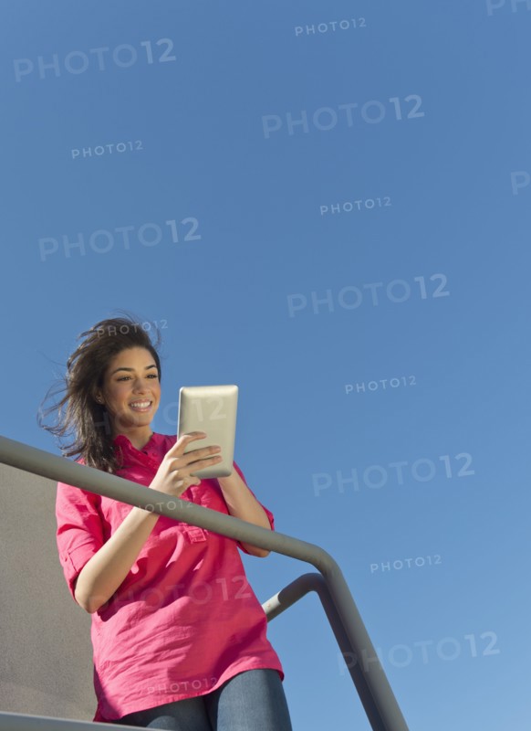 Young woman using tablet pc.