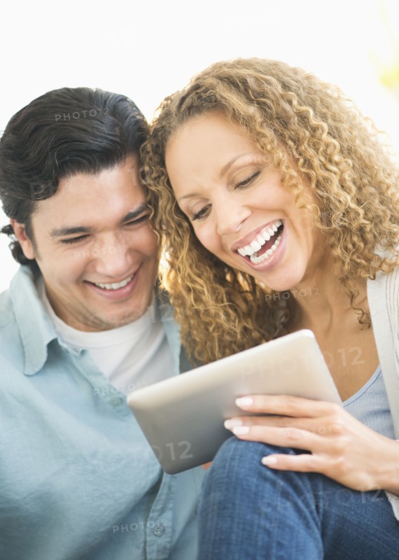 Couple looking at tablet pc.