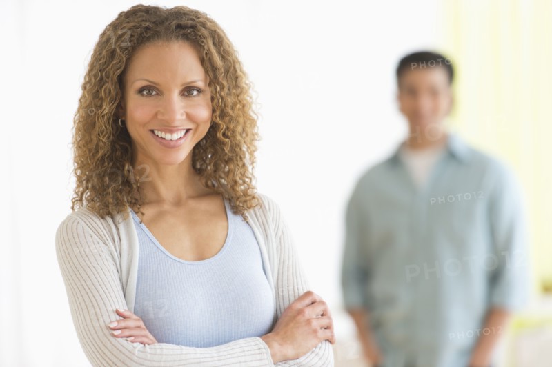 Portrait of couple with focus on woman in foreground.