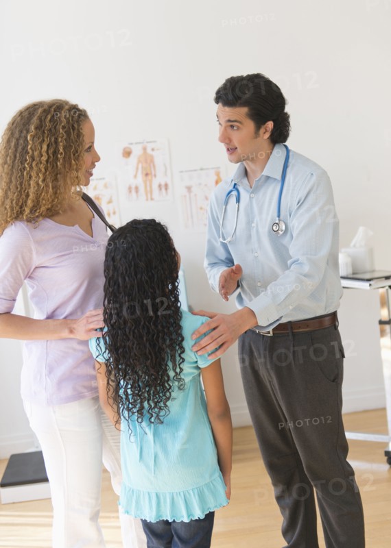 Mother with daughter (12-13) visiting pediatrician.