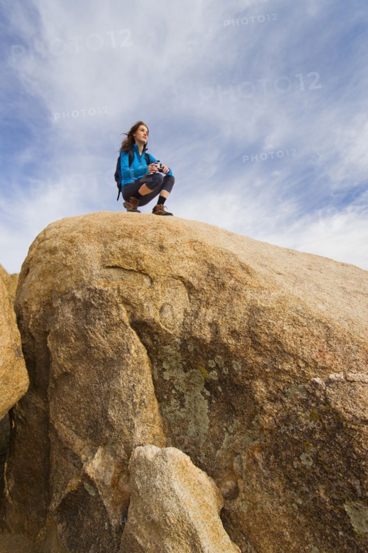 USA, California, Joshua Tree National Park, Female hiker on rocks.