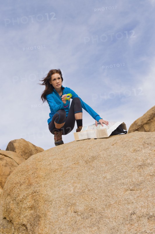 USA, California, Joshua Tree National Park, Female hiker on rocks.