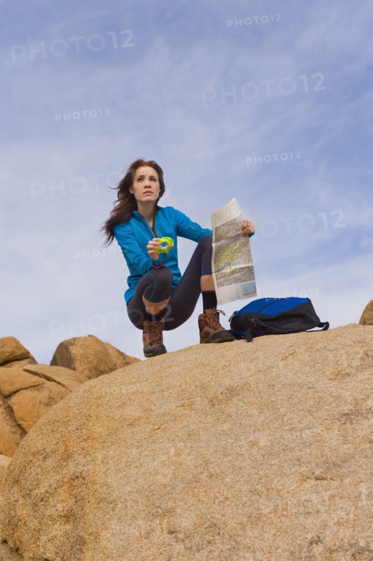 USA, California, Joshua Tree National Park, Female hiker on rocks.
