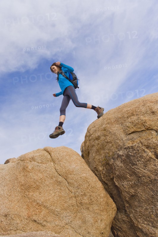 USA, California, Joshua Tree National Park, Female hiker on rocks.