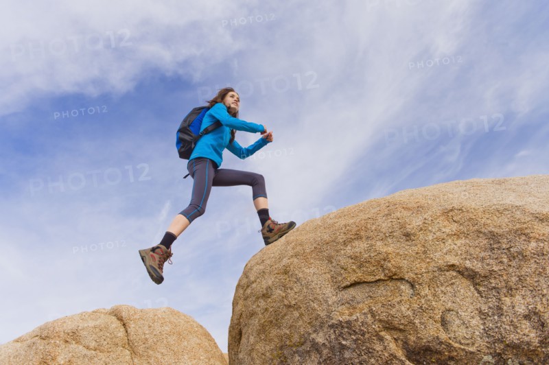 USA, California, Joshua Tree National Park, Female hiker on rocks.
