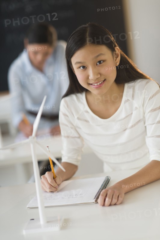Portrait of female student (14-15) at school.