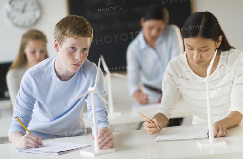 Students (14-19) examining wind turbines.