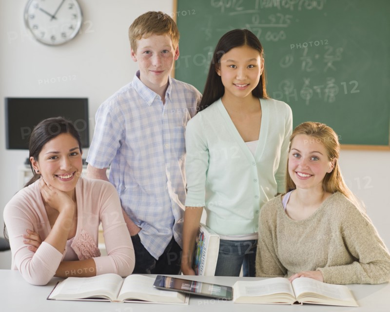 Portrait of students (14-19) in classroom.