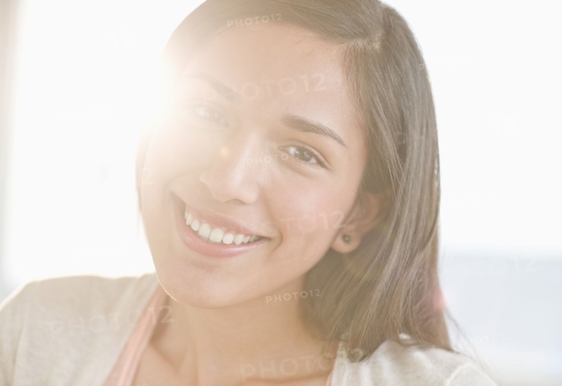 Portrait of young woman smiling.