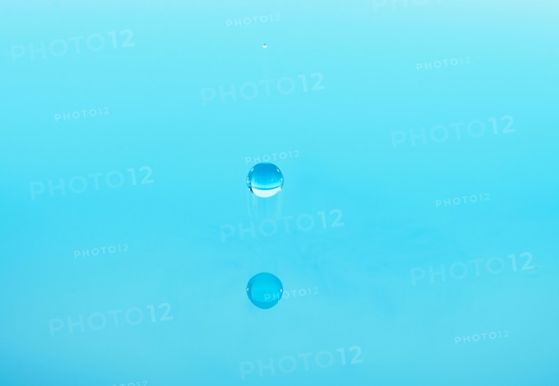 Drop falling into water.