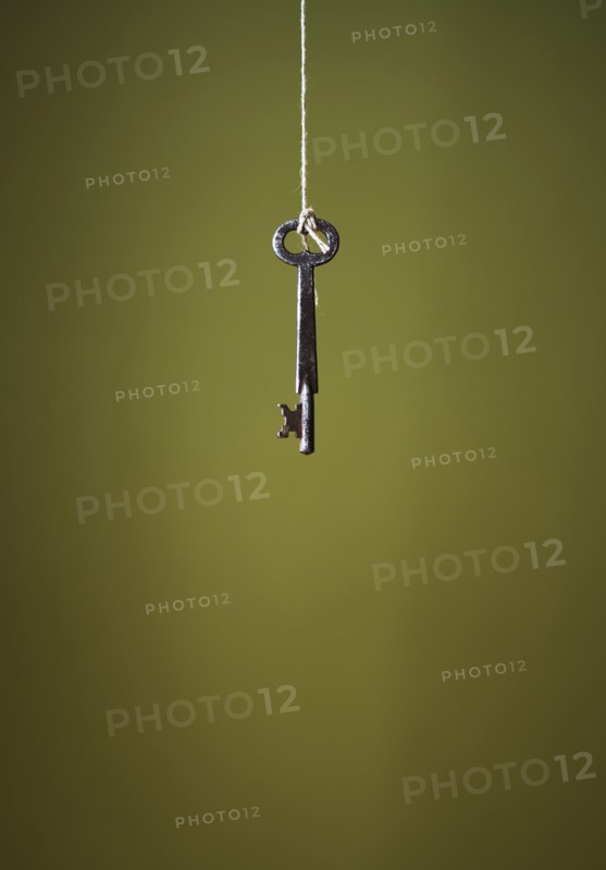 Key hanging on string.