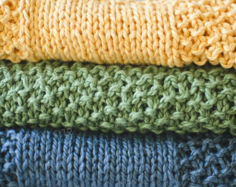 Stack of knitted blankets. 
Photo: Jamie Grill
