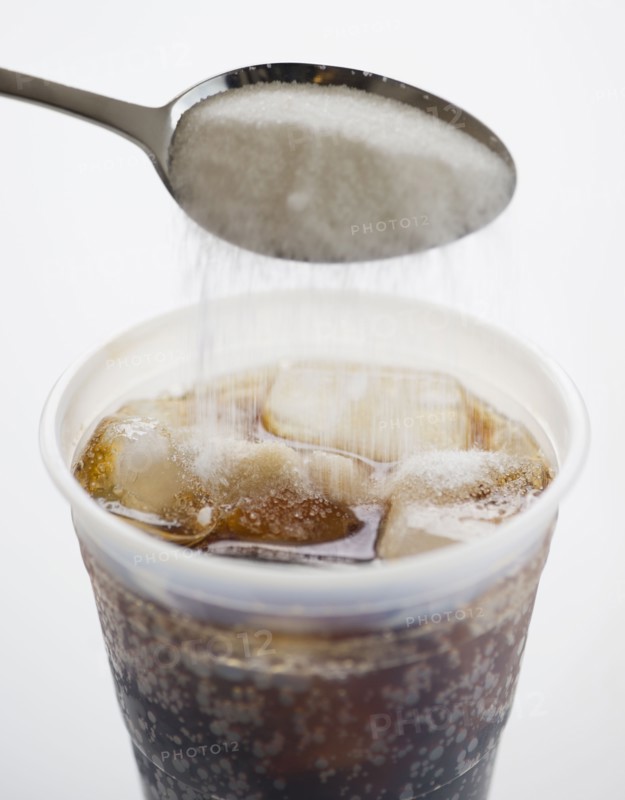 Adding sugar into soda. 
Photo : Jamie Grill