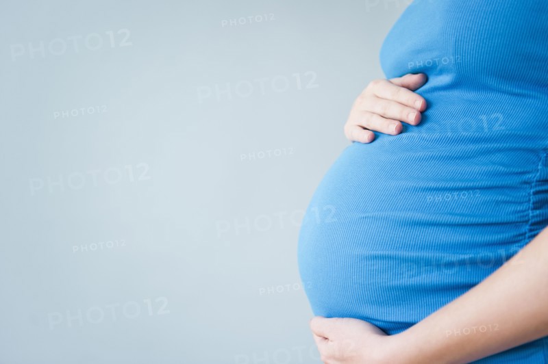 Belly of pregnant woman. 
Photo : Jamie Grill