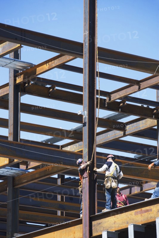 Construction workers on construction frame. 
Photo : fotog