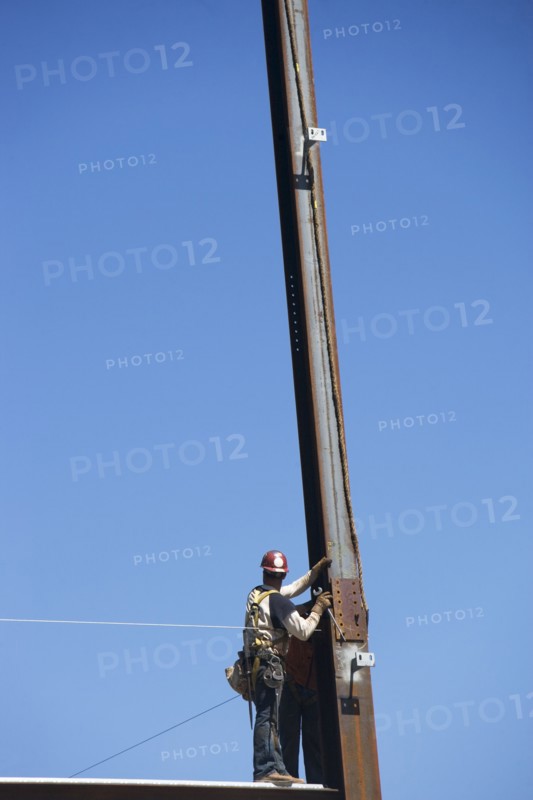 Construction workers on construction frame. 
Photo: fotog