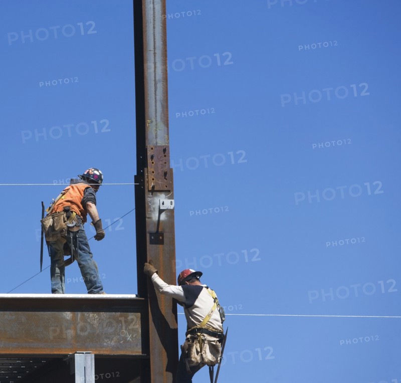 Construction workers on construction frame. 
Photo: fotog