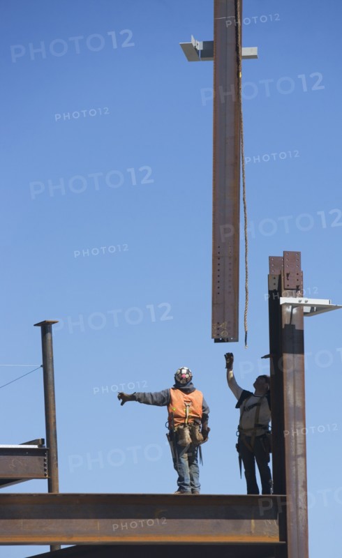 Construction workers on construction frame. 
Photo: fotog