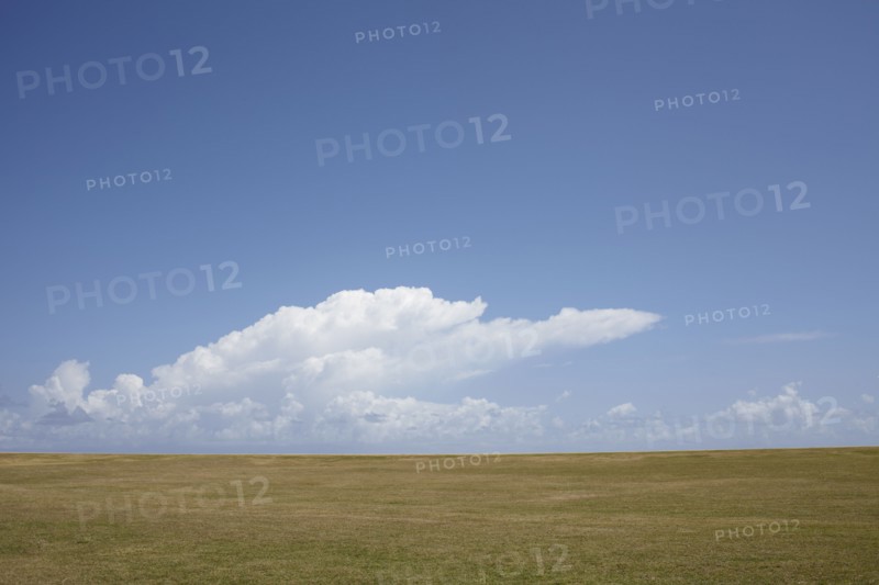 Puerto Rico, Old San Juan, Landscape with field and clouds. 
Photo : Winslow Productions