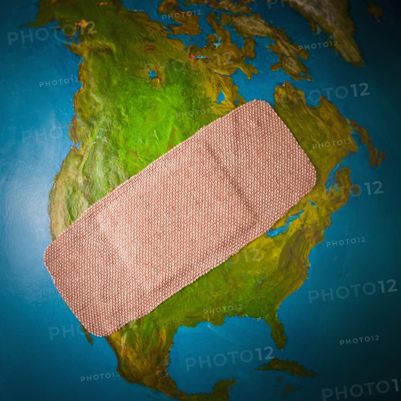 Globe with band-aid . 
Photo : Mike Kemp