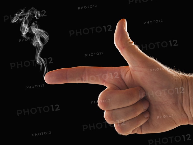 Male hand with smoke coming out of index finger. 
Photo: Mike Kemp