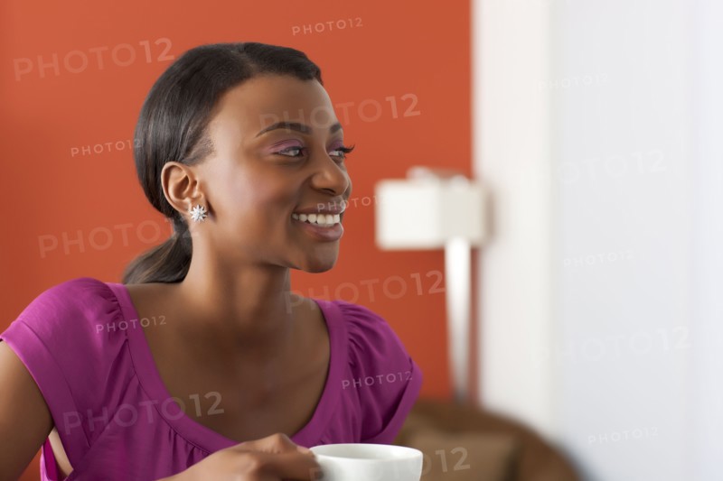 Young woman enjoying morning coffee. 
Photo: Dan Bannister