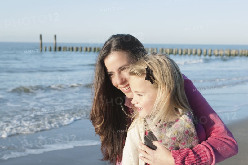 Netherlands, Zeeland, Haamstede, Mother with daughter on beach. 
Photo: Jan Scherders