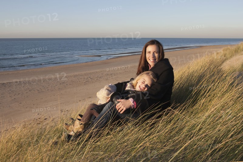 Netherlands, Zeeland, Haamstede, Mother with daughter on beach. 
Photo : Jan Scherders