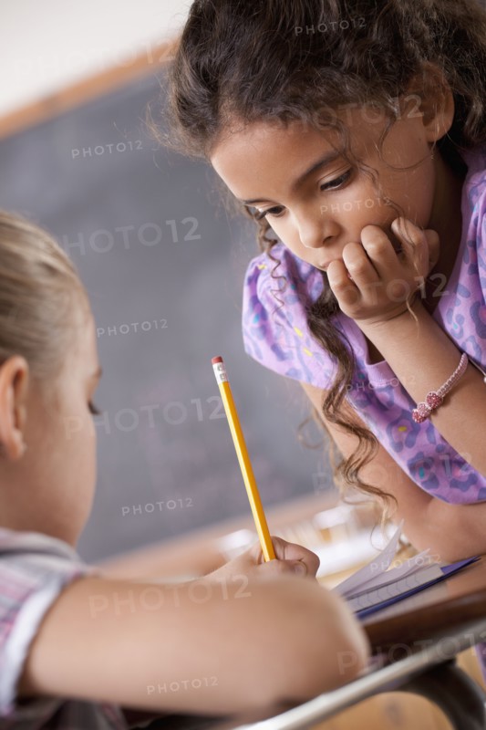 Schoolgirls in classroom. 
Photo : Rob Lewine