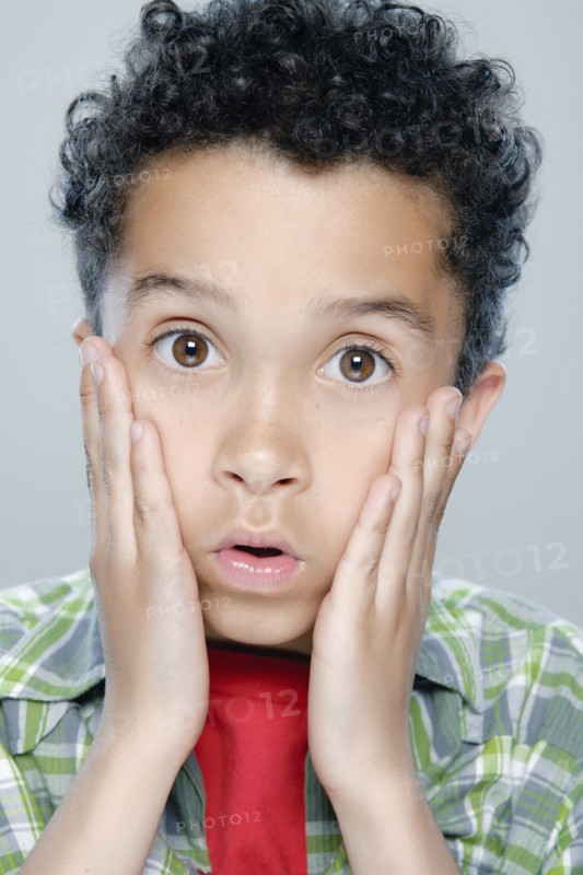 Portrait of boy (8-9), studio shot. 
Photo: Rob Lewine