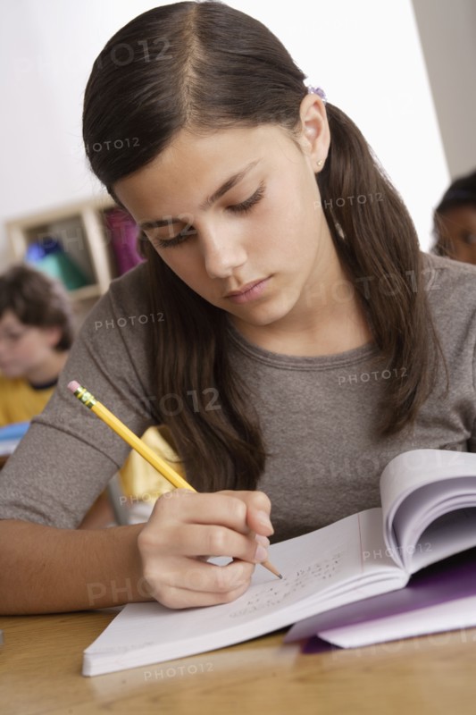 Schoolgirl (12-13) at school. 
Photo : Rob Lewine