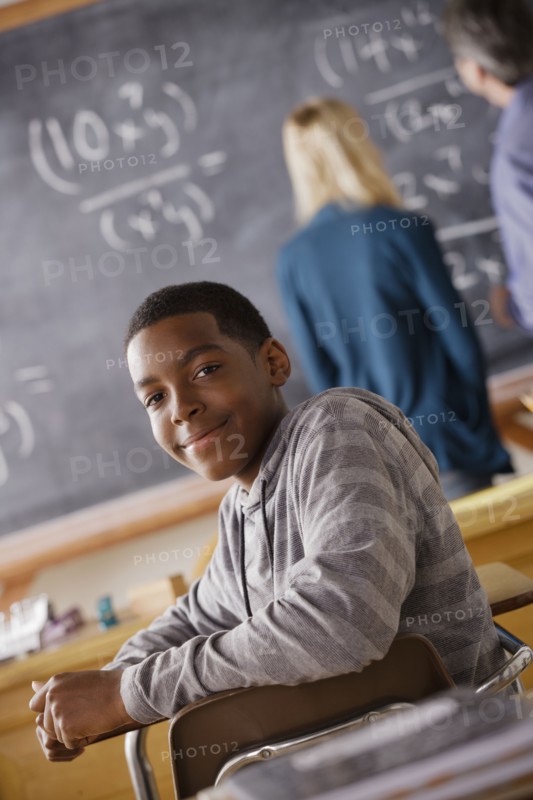 Portrait of teenage boy (14-15) at school. 
Photo : Rob Lewine